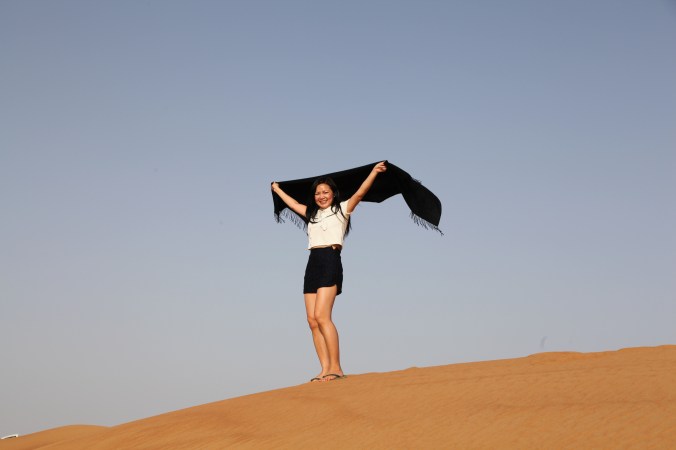 Me on a sand dune in the Arabian desert