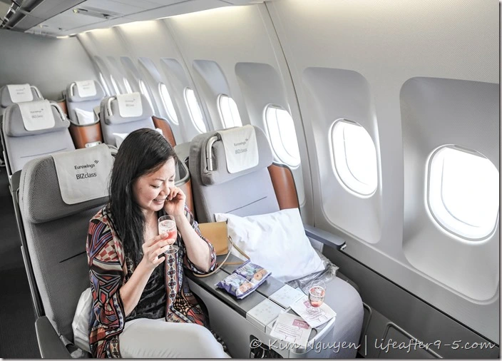 Woman sitting in Eurowings Business Class cabin
